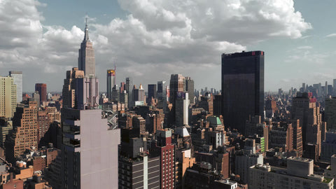 Manhattan skyscrapers from aerial view moving over buildings toward Empire State Building in New York City NYC Midtown