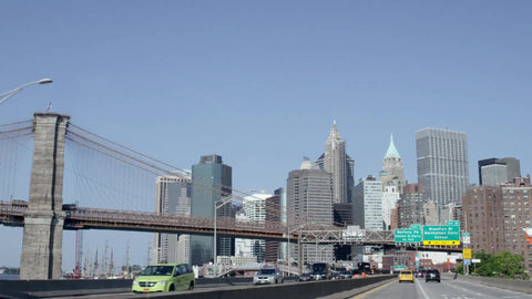 driver pov driving on FDR Drive with Brooklyn Bridge and Lower Manhattan skyline Battery Park sign