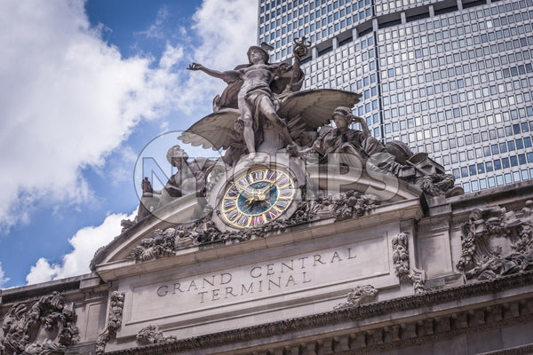 Grand Central Station exterior with clock and statue close up in front of Met-Life Building in Midtown Manhattan