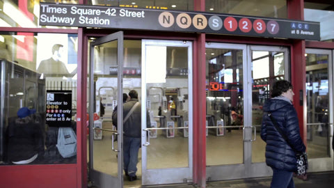 subway entrance doors at 42nd street and Times Square at night in winter