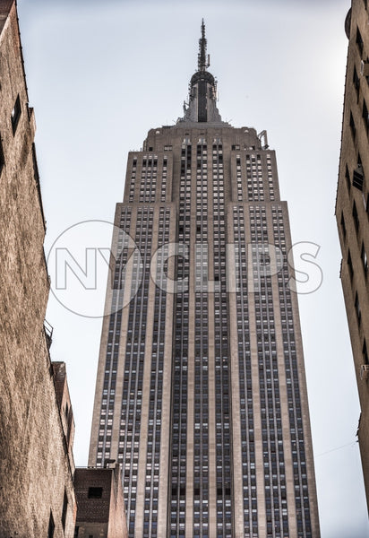Empire State Building upward angle - towering skyscraper in Manhattan
