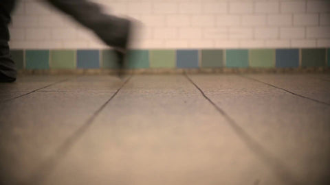 feet walking in subway station - closeup of shoes in NYC
