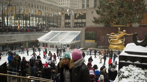 ice skating rink in Rockefeller Center on holidays, Christmas time with tourists during day in NYC