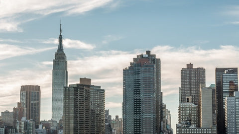 Empire State Building and skyscrapers - section of Manhattan skyline up close in late afternoon early evening