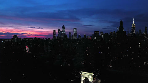 Manhattan at night Washington Square Park arch and Empire State Building New York City NYC