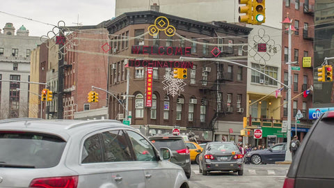 Chinatown welcome sign on busy intersection