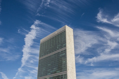 United Nations Building - view from side - isolated on blue sky with clouds on beautiful sunny summer day