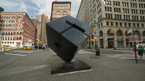 Cooper Square with famous cube sculpture on summer day in Manhattan NYC