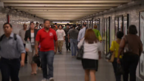 subway corridor - people walking in tunnel in slow motion - summer in NYC