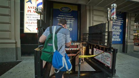 stairs outside Astor Place barbershop - customers walking downstairs to haircut parlor in Greenwich Village Manhattan NYC