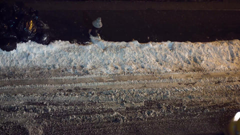 taxi cab driving at night in snow - evening taxicab from overhead view on snowy winter street