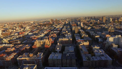 buildings in Harlem from aerial view in late afternoon