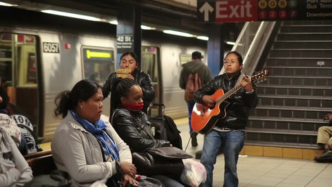 Latin musicians playing music in NYC subway station - South American performers in 1080 HD
