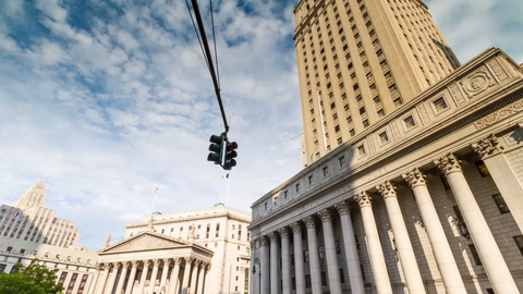 tilting down from blue sky to Foley Square courthouse - 4K timelapse in Downtown Manhattan New York City
