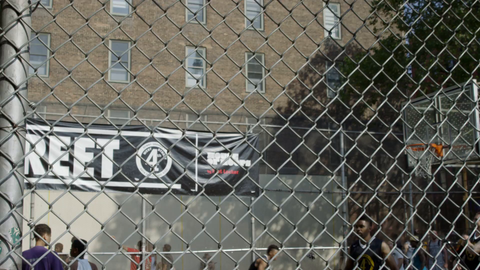kid scoring layup during warmup practice at famous West 4th Street basketball courts on 6th Avenue - slow motion 4K in Manhattan NYC