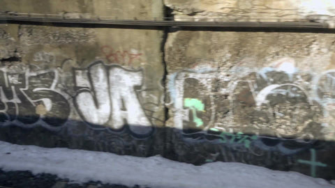 passing graffiti from moving subway train - gritty urban pieces in NYC