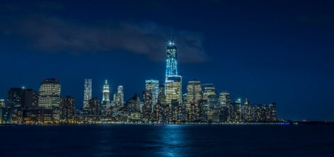 Freedom Tower skyline Downtown Manhattan at night in New York City NYC and East River