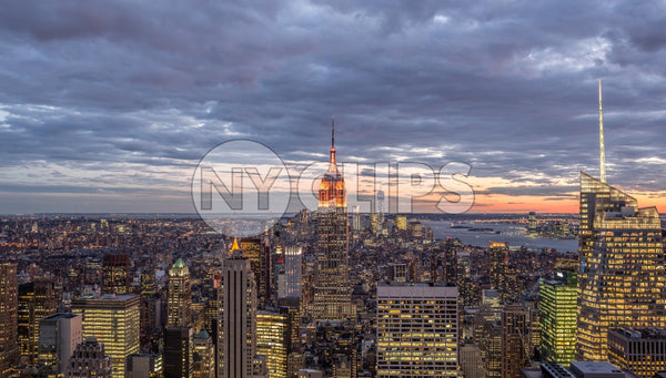 Empire State Building at sunset in early evening - Manhattan cityscape with skyscrapers from high view