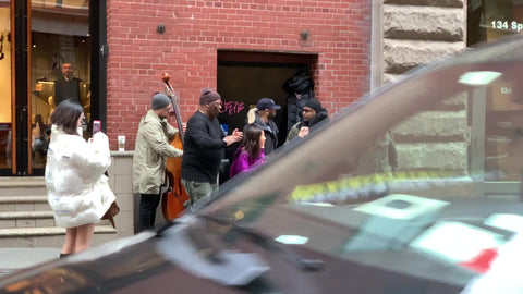 music group singing in street - singers entertaining pedestrians in New York City NYC