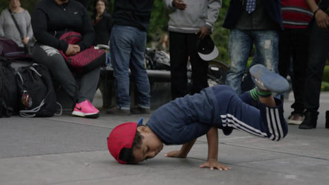 bee boy break dancer kid breakdancing in summer Washington Square Park 4K slow motion