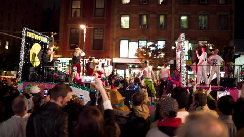 Halloween parade float with crowd on 6th avenue
