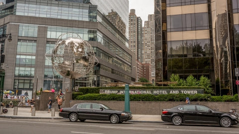 Columbus Circle with famous globe sculpture and Trump International Hotel and Tower - Midtown Manhattan on sunny summer day in NYC