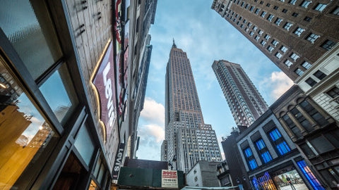 Levi's store on 34th street with Empire State Building, famous skyscraper - landmark tower in Manhattan