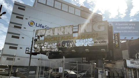 parking lot sign with graffiti on West Side Highway winter Manhattan New York City NYC