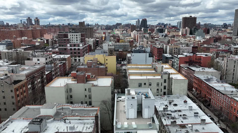 aerial moving side over East Harlem in NYC