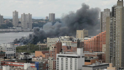 building on fire on west side of Manhattan - smoke coming from buildings in NYC