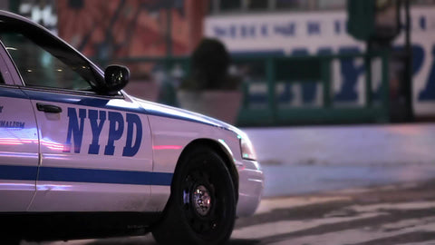 parked police car at night - NYPD vehicle on street in NYC