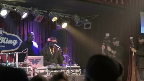 DJ Funkmaster Flex performing at hip hop show - crowd cheering - standing in concert - fans watching music