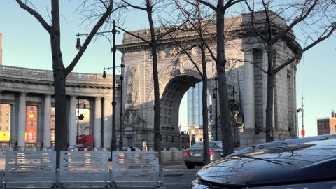 cars entering Manhattan Bridge entrance arch to Brooklyn New York City NYC