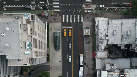 overhead aerial cars driving in Midtown Manhattan traffic NYC