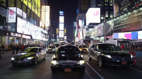 Uber driving in Times Square in slow motion at night - limousine grill in NYC