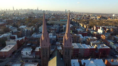 aerial flying through church steeples in the Bronx
