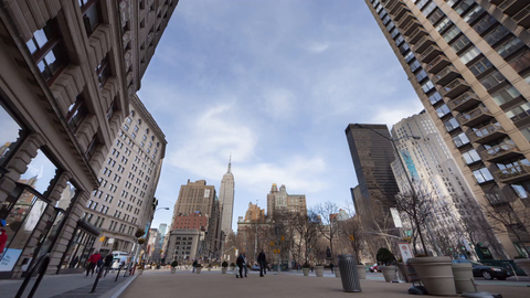 Empire State Building and people walking during day in Madison Square Park in Manhattan NYC - 4K timelapse