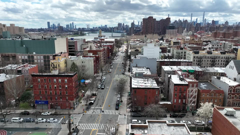 aerial moving forward low over East Harlem in NYC