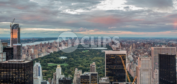 Central Park from aerial high view with buildings and skyscrapers at sunset in Manhattan NYC