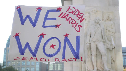 We Won sign close up at Biden Harris 2020 presidential election victory celebration in Washington Square Park New York City