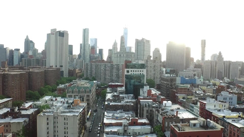 Manhattan skyscrapers moving down to gritty Chinatown street NYC