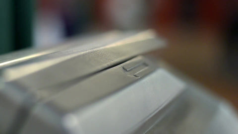 Metro Card swipe at turnstile up close - tight shot of hand swiping in subway station in NYC