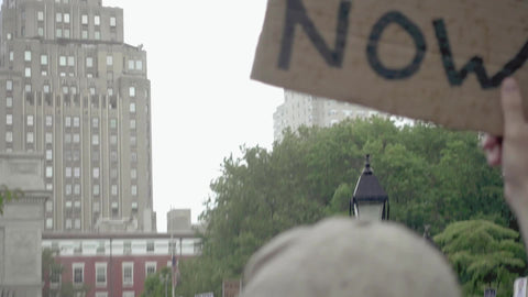 defund the police NYPD sign at BLM rally in NYC