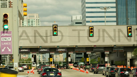 approaching Holland Tunnel tollbooth with EZ-Pass line from driving car in New Jersey