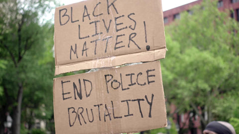 Black Lives Matter and End Police Brutality sign at BLM rally in New York City