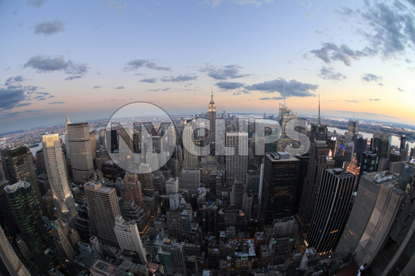 Manhattan cityscape from high aerial view - Empire State Building at sunset - beautiful evening lights in city