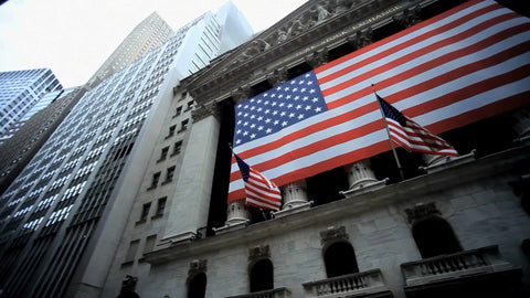 New York Stock Exchange - NYSE panning across American flag in Wall Street in Lower Manhattan - Downtown New York City NYC 1080 HD