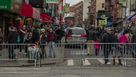 Little Italy sign - welcome - Chinese new year parade in Chinatown - crowded with people behind police barrier