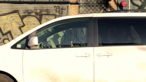 gritty Dowtown Manhattan street with closed shops graffiti on gates during covid pandemic winter New York City NYC