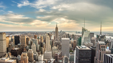 zooming in on Empire State Building cityscape 4K timelapse day to beautiful red sunset night sky - skyscrapers in Manhattan